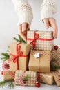 Young woman hands taking a gift box from a big stack of gifts Royalty Free Stock Photo