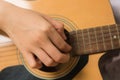Young woman hands touching guitar chords Royalty Free Stock Photo