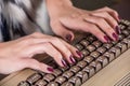 Female hands typing on old computer keyboard in office Royalty Free Stock Photo