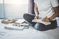 Young woman happiness on bedroom in enjoying reading books, news Royalty Free Stock Photo