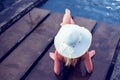 Young woman happy in big hat relaxing on the swimming pool, travel near the sea and beach. Concept summer Royalty Free Stock Photo