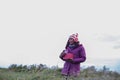 Young women are happy the winter in garden