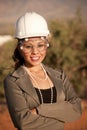 Young woman in hard hat and safety goggles Royalty Free Stock Photo