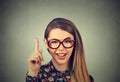 Young woman has idea, pointing with finger up Royalty Free Stock Photo