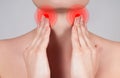 Young woman has sore throat touching the neck Royalty Free Stock Photo