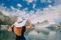 Woman in hat stands on cruise liner background, rear view Royalty Free Stock Photo