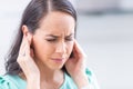 Young woman have headache migraine stress or tinnitus - noise whistling in her ears Royalty Free Stock Photo