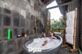 Young woman having a bath