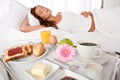 Young woman having breakfast in bed Royalty Free Stock Photo