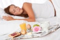 Young woman having breakfast in bed Royalty Free Stock Photo