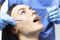 Young Woman Having Check Up And Dental Exam At Dentist
