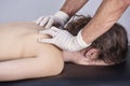 Young woman having chiropractic back adjustment. Physiotherapy, sports injury rehabilitation. Osteopathy, Alternative medicine, Royalty Free Stock Photo