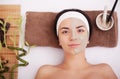 Young woman having clay skin mask treatment on her face Royalty Free Stock Photo