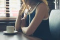 Young woman having coffee in diner Royalty Free Stock Photo