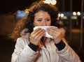 Young woman having cold, nose running Royalty Free Stock Photo