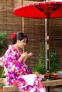 Young woman having dessert in tea house Royalty Free Stock Photo