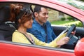 Young Woman Having Driving Lesson With Instructor Royalty Free Stock Photo