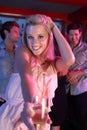 Young Woman Having Fun In Busy Bar Royalty Free Stock Photo