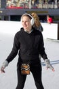 Young Woman Having Fun While Ice Skating