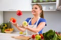 Young woman having fun in kitchen Royalty Free Stock Photo