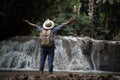 Young woman having fun under waterfalls Royalty Free Stock Photo