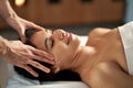Young woman having head massage at the spa. Royalty Free Stock Photo