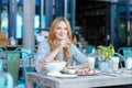 Young woman having healthy breakfast in outdoor Royalty Free Stock Photo