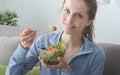 Young woman having lunch at home Royalty Free Stock Photo