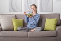 Young woman having lunch at home Royalty Free Stock Photo