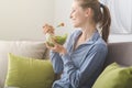 Young woman having lunch at home Royalty Free Stock Photo