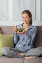 Young woman having lunch at home Royalty Free Stock Photo