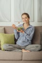 Young woman having lunch at home Royalty Free Stock Photo