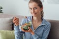 Young woman having lunch at home Royalty Free Stock Photo