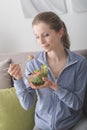 Young woman having lunch at home Royalty Free Stock Photo