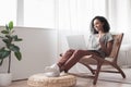 Young woman having meeting online at home. Student girl using laptop computer in her room Royalty Free Stock Photo