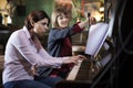 young woman having piano lesson