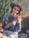 Young woman having picnic in lavender field Royalty Free Stock Photo