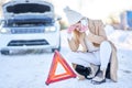 Young woman having problem with car in winter Royalty Free Stock Photo