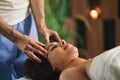 Young woman having relaxing head massage at the spa. Royalty Free Stock Photo