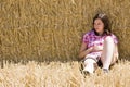 Young woman in haystack