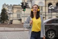 Young woman with headphones crossing street Royalty Free Stock Photo