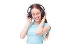 Young woman with headphones listening to music and dancing. Royalty Free Stock Photo