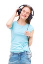 Young woman with headphones listening to music and dancing Royalty Free Stock Photo