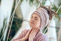 Young woman in a headwear looking inspired