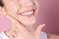 Young woman with healthy teeth and beautiful smile on color background Royalty Free Stock Photo