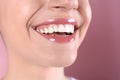 Young woman with healthy teeth and beautiful smile on color background Royalty Free Stock Photo