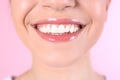 Young woman with healthy teeth and beautiful smile on color background Royalty Free Stock Photo