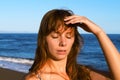 Young woman with heatstroke. Sunstroke on a beach. Healthy lifestyle on vacation