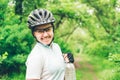 Young woman drinking water after doing some bicycle exercise Royalty Free Stock Photo