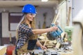 young woman working in carpenter& x27;s workshop Royalty Free Stock Photo